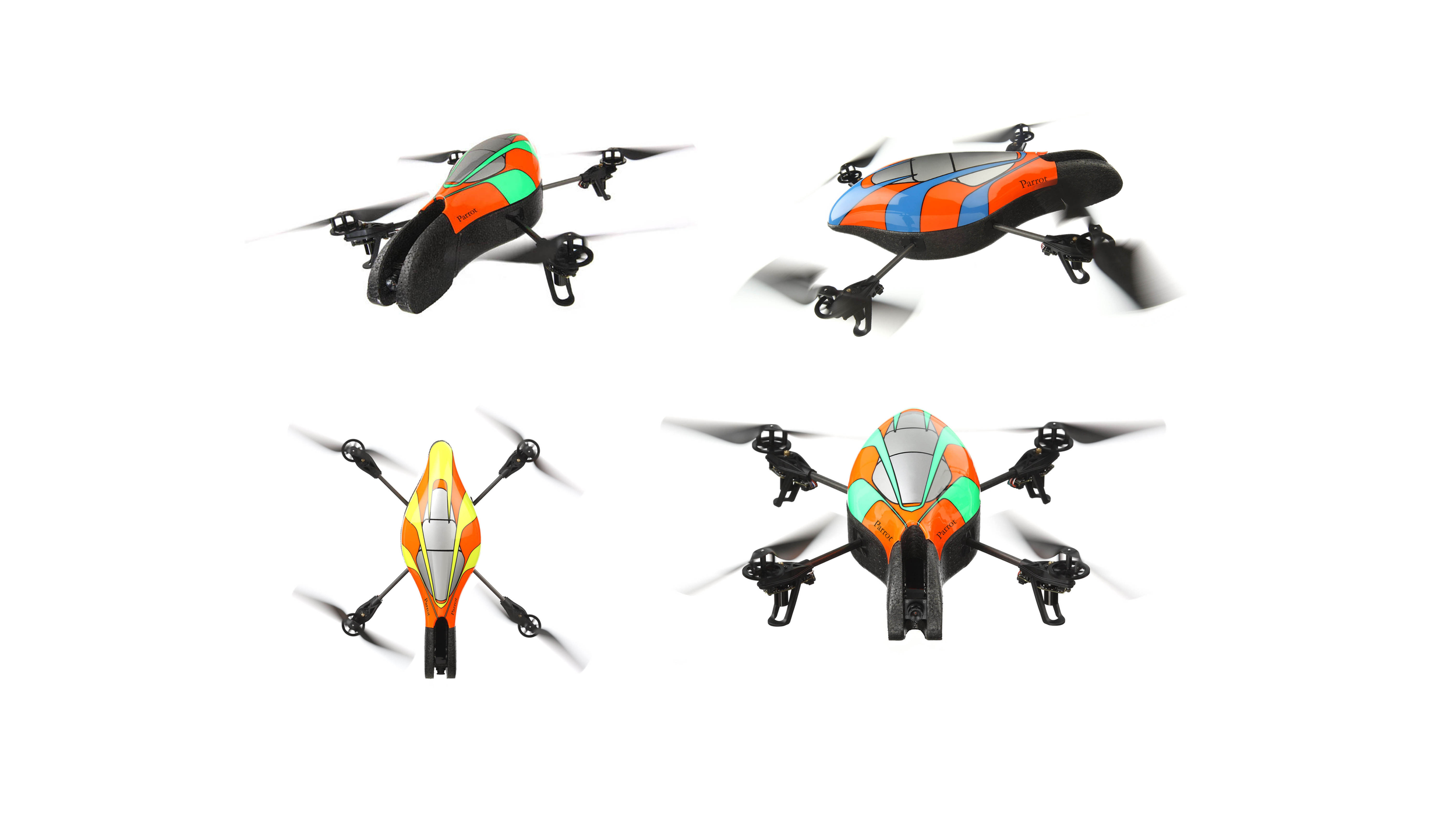 Four Parrot AR.Drone quadcopters with spinning rotors and different colored hulls (green-orange, blue-orange, yellow-orange) shown from various angles