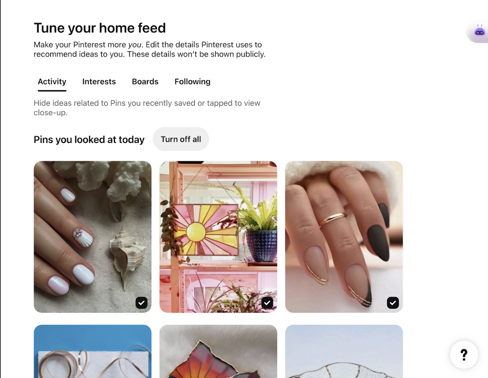 Pinterest "Tune your home feed" settings screen with a grid of saved nail-art and stained-glass pins.