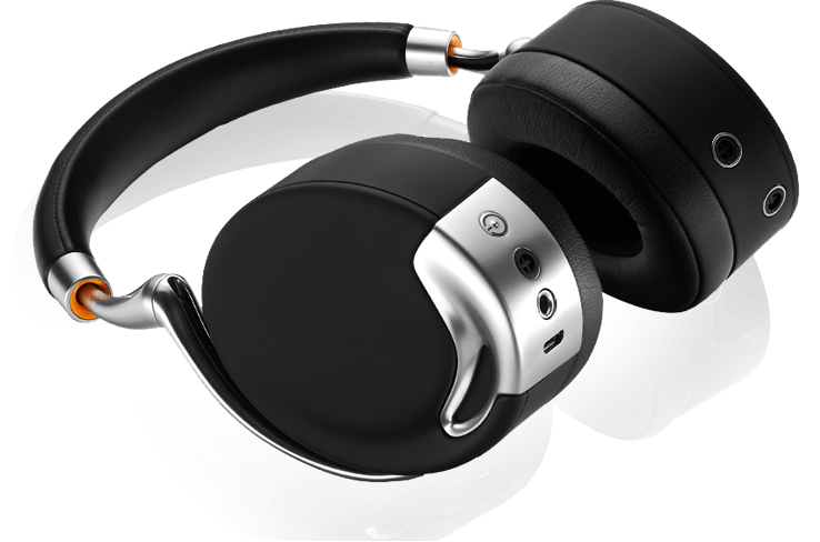 Black Parrot Zik headphones with silver hinges and orange accents, resting on a white surface